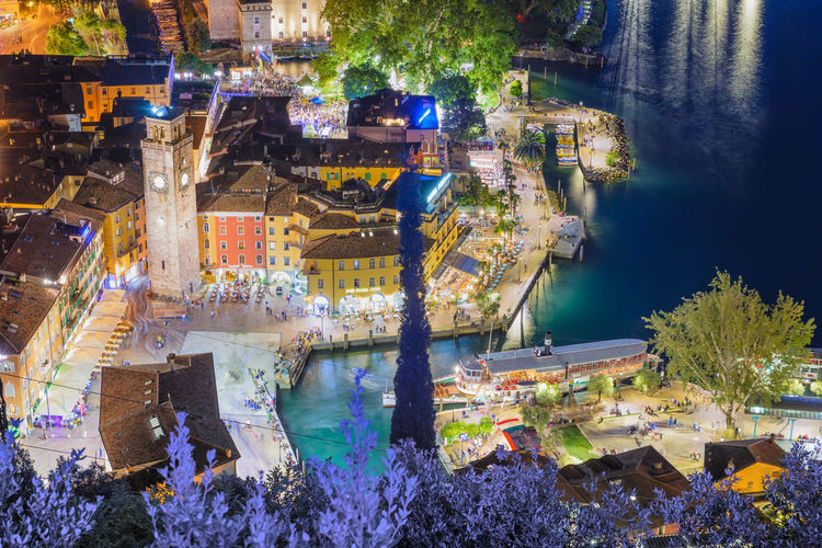 High angle shot of illuminated townscape by river