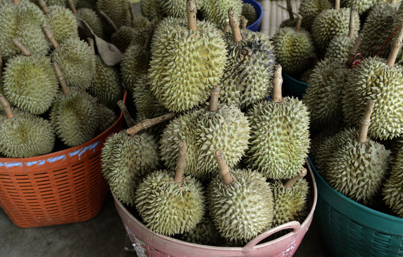 Durians in baskets for sale at street market