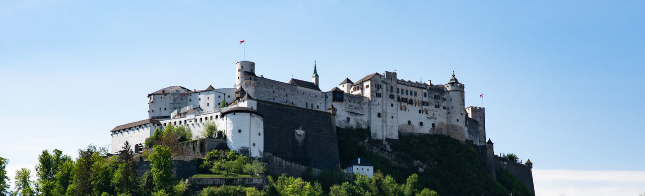 Low angle view of castle hohensalzburg against sky