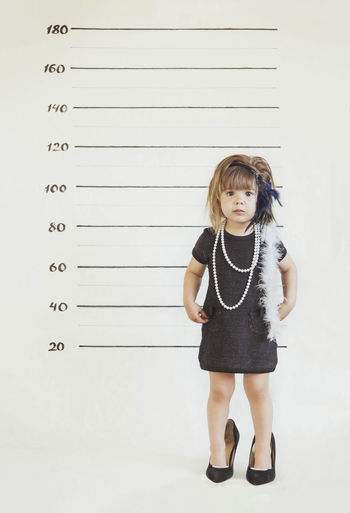 Baby portrait in gangster costume at the police station