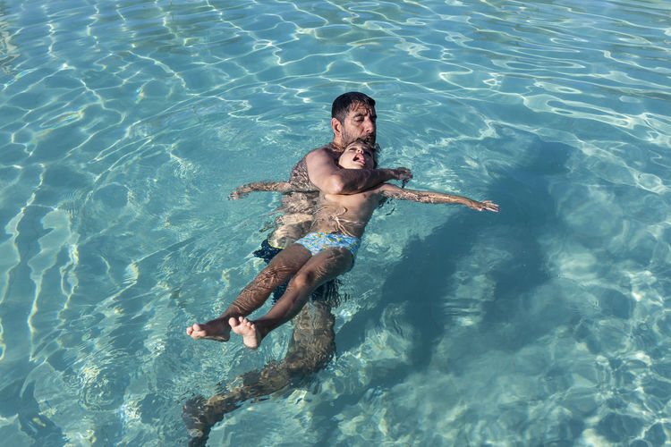 Man rescuing boy who was drowning