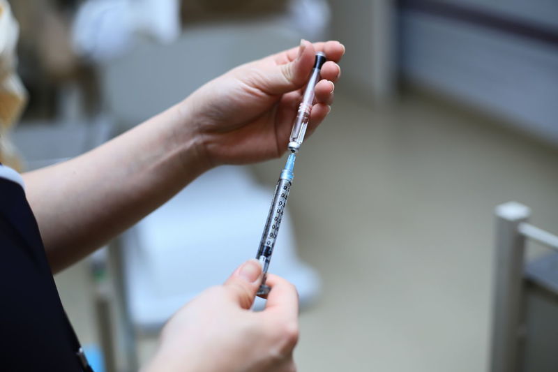 Close-up of doctor holding medicine