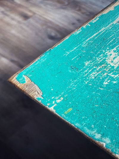 High angle view of blue paint on table