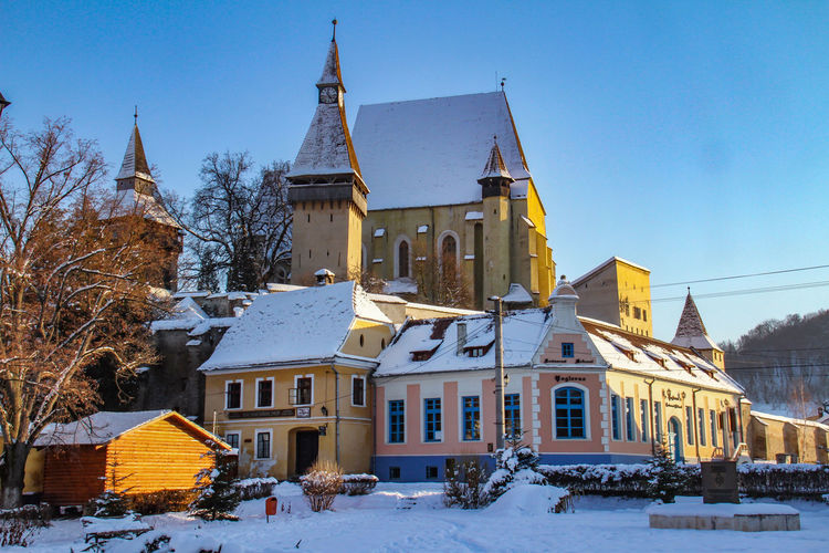 Low angle view of buildings in winter