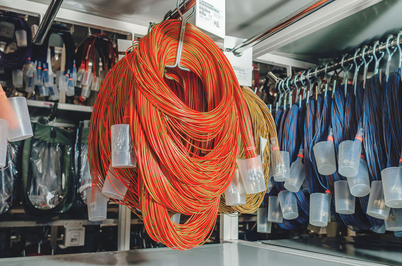 Showcases with wound colored cables for car production. industrial details