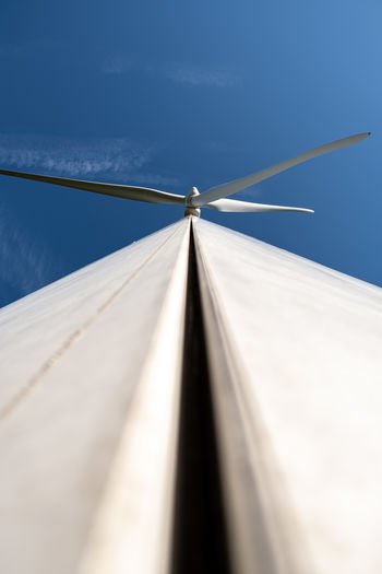 Low angle view of windturbine against clear sky