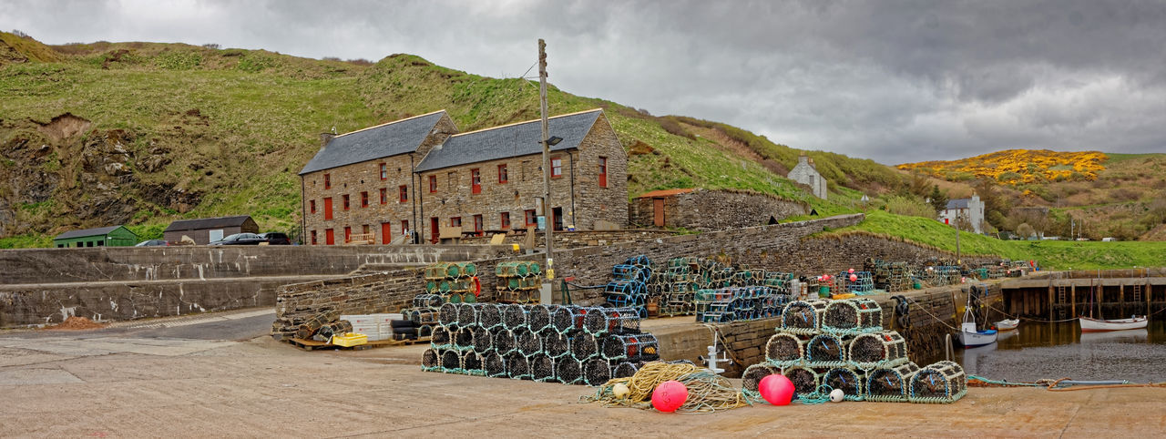 Panoramic view of traditional building against cloudy sky
