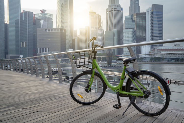 Bicycles on street against buildings in city