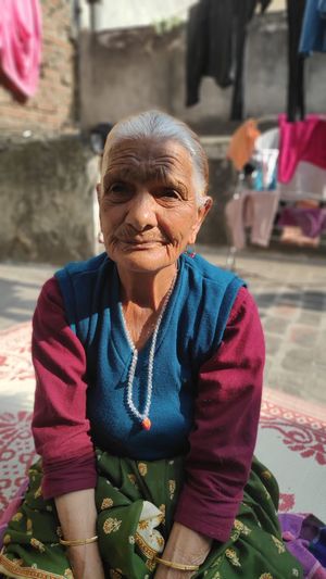 Portrait of senior woman sitting outdoors