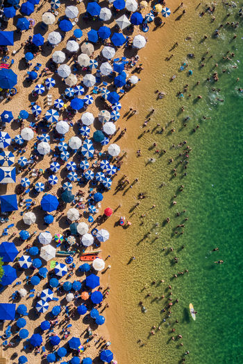Aerial view of people enjoying at beach