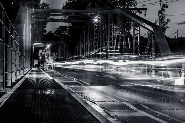 Illuminated road in city at night
