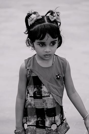 Cute girl standing at beach
