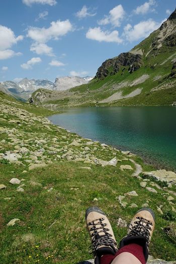 Low section of person relaxing on mountain