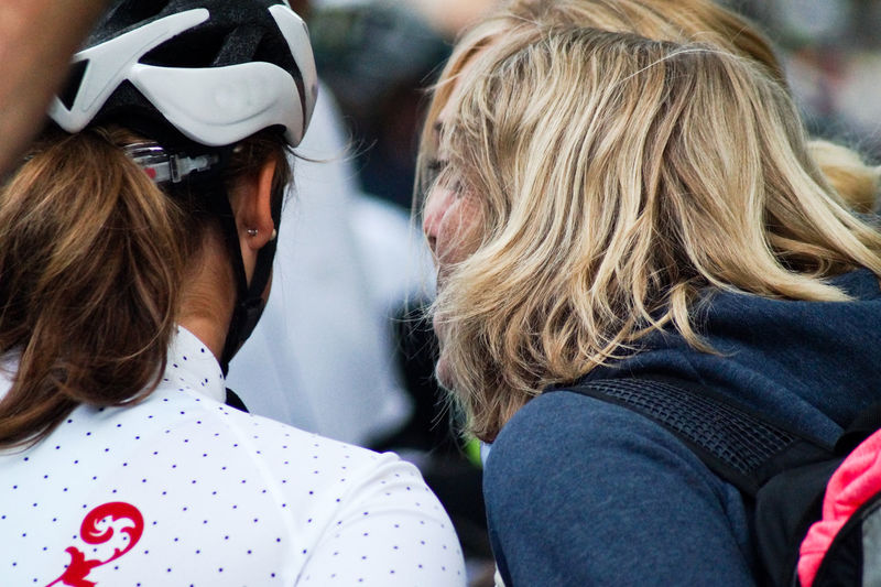 Rear view of women with cyclist