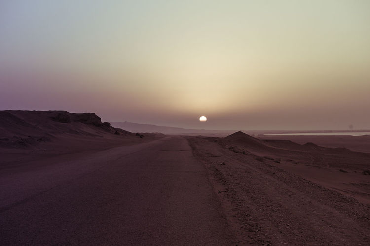 Scenic view of desert against clear sky