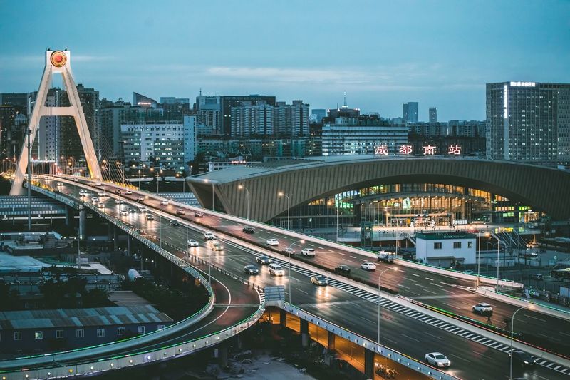 High angle view of illuminated bridge in city against sky