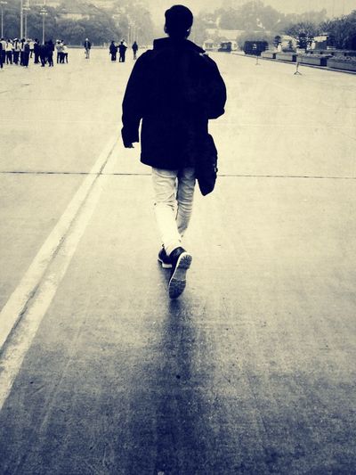 Full length of woman walking on road