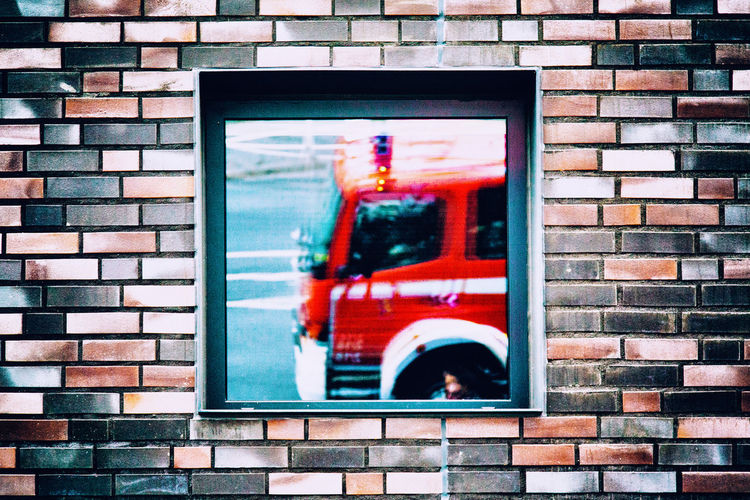 Reflection of fire engine on house window