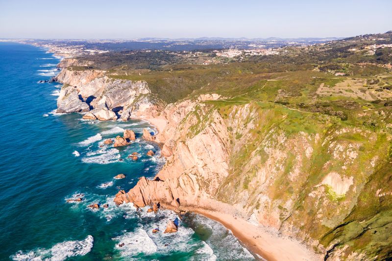 High angle view of rocks on sea against sky