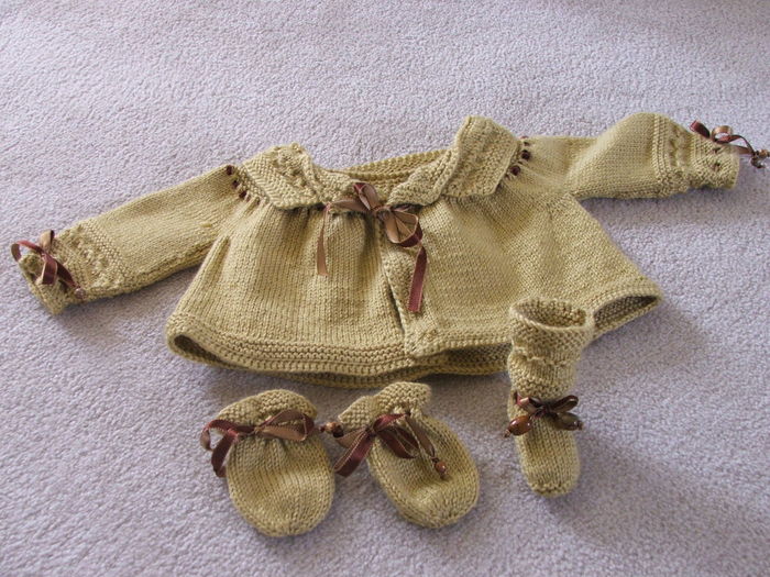 High angle view of knitted baby clothing