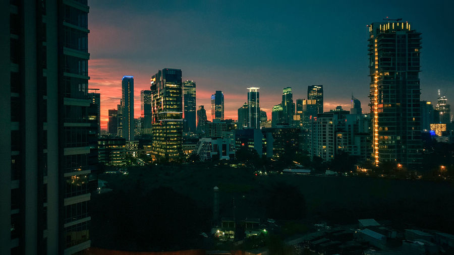 Illuminated buildings in city at night