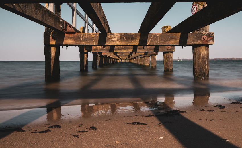 Pier over sea against sky