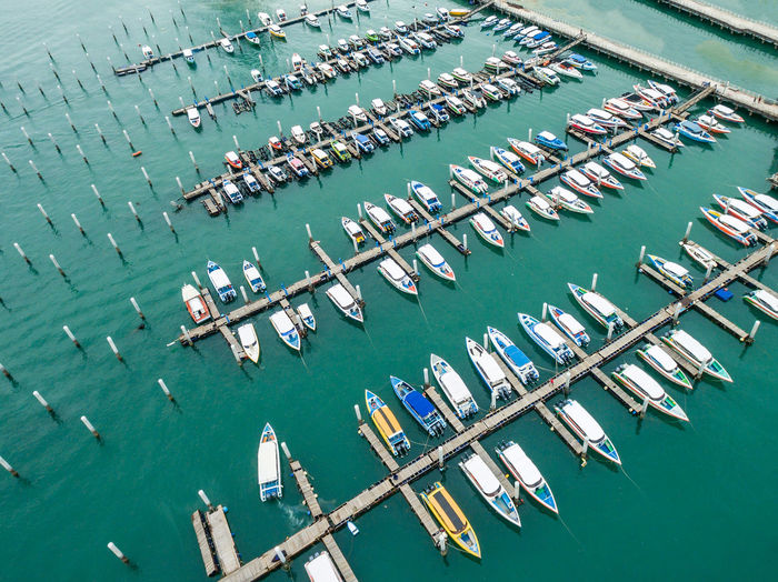 High angle view of sailboats moored in harbor