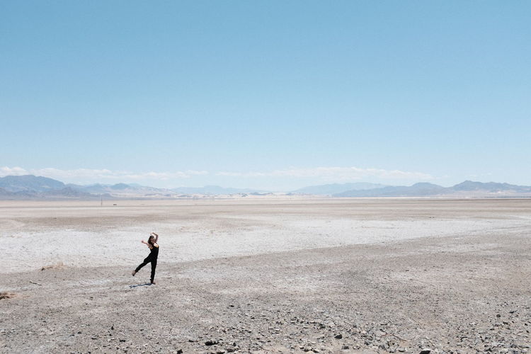 Full length of a man standing on desert
