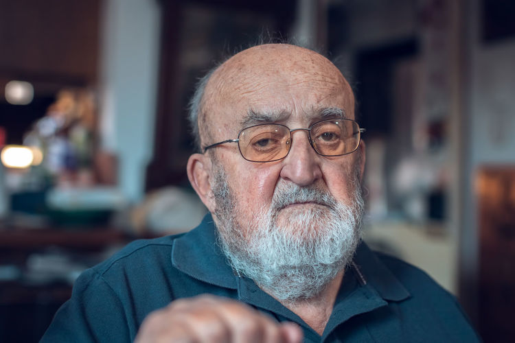 Portrait of old man wearing eyeglasses