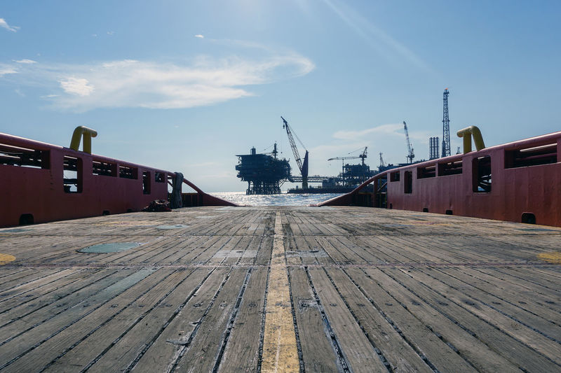 View of a production platform from an anchor handling tug boat at offshore oil field