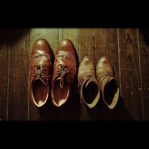 Close-up of shoes on wooden floor