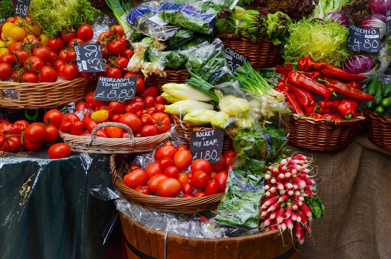 Vegetables in basket for sale at market stall