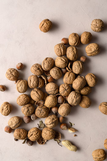 Close-up of roasted coffee beans on white background